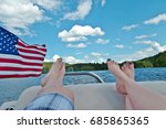Relaxing on the lake with an American Flag waving. 