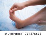 Small photo of Woman has numbness on her right foot. Cramp, Spasm, Twinge, Sprain