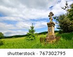 Old Stone Cross In Forest Of...