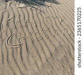 Small photo of Lettering in the sand, Isla Cristina, Costa del la Luz, Spain, square format