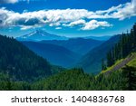 Looking at Mt Jefferson through the forests on the valleys and ridges of the central cascade mountains in the Willamette National Forest, Oregon