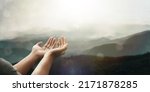 Small photo of The two hands of a young man who prayed for hope from God Praise God concept. Pray, communicate. Mountain nature background. at sunrise