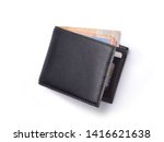 Top view of New black genuine leather wallet with banknotes and credit card inside isolated on white background.