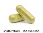 Close-up Two Herb powder capsules isolated on white background. Clipping path.