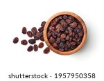 Flat lay of Raisins in wooden bowl isolated on white background.