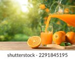 Pouring orange juice into the...