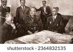 Small photo of Istanbul, Turkey - September17, 2023:Ataturk, the founder of the Republic of Turkey, receives information about military maneuvers with soldiers at the Florya Mansion.1930s