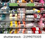 Small photo of Lynnwood, WA USA - circa August 2022: Wide view of a variety of yarns for sale inside a Joann Fabrics store.