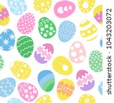 seamless easter eggs background.... | Shutterstock .eps vector #1043203072