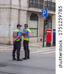 Small photo of Lisbon, Portugal - 06 06 2020: Portuguese police officers on the street in Lisbon, during the Coronavirus Covid-19 epidemic, with face protections. Two policeman's of Public Security Police (PSP).