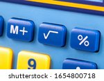 Small photo of Simple square root symbol button on a colorful calculator keypad macro, closeup. Basic algebra symbols, easy math nomenclature, learning mathematics, finances, early education, teaching aids concept