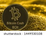 Coin cryptocurrency BCH and gold fabric background. Bitcoin cash logo.
