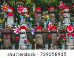 Small photo of Tokyo, Japan - July 3, 2017 -Japanese Jizo Statues dedicated to the safety of children and as a memorial for still birth or miscarried children (Translation; Japanese surname Nakamura), Zojoji Temple
