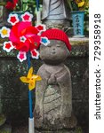 Small photo of Tokyo, Japan - July 3, 2017 - Japanese Jizo Statue dedicated to the safety of children and as a memorial for still birth or miscarried children (Translation; Japanese surname Nakamura), Zojoji Temple