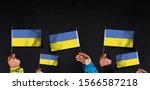 hands holds flags of ukraine on ... | Shutterstock . vector #1566587218
