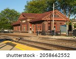 Small photo of Plano, Illinois - United States - September 18th, 2021: Exterior of the Plano Station, opened in 1913, on a beautiful sunny morning.