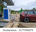 Small photo of Bangkok,Thailand 9July 2022: The electric car is being charged at a special place for charging electric vehicles. A modern and eco-friendly mode of transport that has become widespread at Asia.