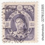 Small photo of JAPAN - 1908: An 10 yen dark violet postage stamp depicting portrait of Empress Jingo. Empress Jingu was a legendary Japanese empress who ruled as a regent following her husband's death in 200 AD