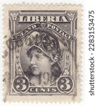 Small photo of LIBERIA - 1903: An 3 cents black postage stamp depicting personification of Liberty. Republic of Liberia, is a country on the West African coast