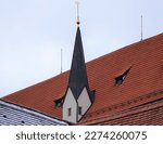 Red Roof and unusual spire in the Bavarian town of Fussen Germany, Europe.