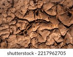Small photo of Dried cracked desert sand and soil in the arroyo or wash in Red Rock Park in Gallup, McKinley County, New Mexico, USA