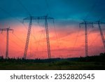 Electricity pylons and cables against the stormy sunset sky on TransCanada Highway on Route 1 in St John, New Brunswick, Canada, abstract artificial shapes and geometry in nature