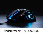 Blue light computer gaming mouse in dark tone