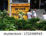 Small photo of New Delhi, India - 05-05-2020: People seen waiting outside a government liquor shop in Malviya Nagar after relaxations allowing their opening on May 5, 2020 in New Delhi, India.