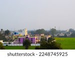 Small photo of Bina, India 2022: Cityscape with huge green garden around a house