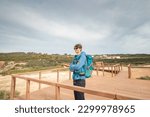 Small photo of Vagabond wandering the Portuguese countryside on the Fisherman Trail enjoys views of the Atlantic Ocean at a viewpoint. Odemira region, Rota Vicentina.