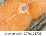 Small photo of Proper healthy nutrition. Raw red salmon fish slice close-up with texture. Product containing vitamin D, A, B, C, PP phosphorus, iodine, calcium, potassium, sodium, magnesium, zinc, fluorine, omega-3.