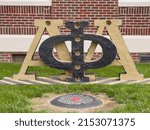 Small photo of Greensboro, NC - April 2, 2022: Alpha Phi Alpha Fraternity Sign on the campus of North Carolina Agricultural and Technical State University. Historically Black College and University - HBCU