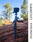 Small photo of SEDONA, ARIZONA / USA - May 18, 2018: GoPro Hero 5 camera set on top of a Joby Gorillapod in the middle of a hiking path.