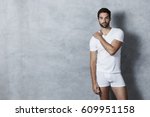 T-shirt and shorts guy in grey studio