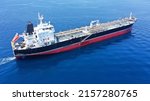 Small photo of Aerial drone photo of industrial crude oil - fuel tanker ship cruising deep blue Mediterranean sea