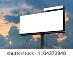 Big white billboard on the street in the sunset . Sky background. Copy space.