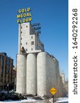Small photo of MINNEAPOLIS-MINNESOTA, APRIL 1, 2018: Arguably one of the most iconic riverfront sights in Minneapolis, the twin Gold Medal Flour signs were built in 1910. The sign is part of a vibrant riverfront