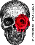 Small photo of metallic-looking skull in katrina style, with a red rose in the eye socket