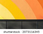 Urban minimalist photography. Warm Colour Palette. Wall Painting with Curved Lines. Abstract Facade Detail and Background.