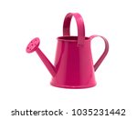 Pink watering can isolated on a ...