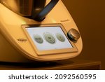 Small photo of Portland, OR, USA - Nov 1, 2021: Closeup of a Vorwerk Thermomix TM6 all-in-one cooker on the kitchen counter. Vorwerk is a diversified corporate group headquartered in Wuppertal, Germany.