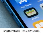 Small photo of Portland, OR, USA - Feb 17, 2022: Apple Wallet app icon is seen on an iPhone. The app enables users to keep their credit and debit cards, driver’s license, state ID, transit cards, keys, tickets, etc.