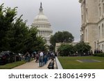 Small photo of Washington, DC, USA - June 23, 2022: Employees line up to enter the Cannon House Office Building, the oldest Congressional office building outside of the U.S. Capitol Building in the morning.