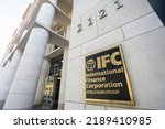 Small photo of Washington, DC, USA - June 25, 2022: The entrance to the IFC headquarters building in Washington, DC. IFC provides financing of private-enterprise investment in developing countries around the world.