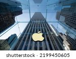 Small photo of New York, NY, USA - July 9, 2022: Apple logo is seen at the Apple flagship store on the 5th Avenue in NYC. Apple, Inc. is an American multinational tech company headquartered in Cupertino, California.