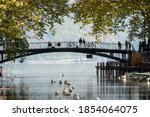 View of the Pont des Amours (Love Bridge) in the city of Annecy, in Haute-Savoie, France. In the background, there is the famous lake.