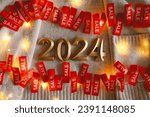Red sale tag with numbers 2024. Advertising of Black Friday cheap clothes. 2024 season sale concept.