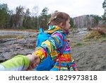 Follow me - Child daughter wanting her mother to follow her in travel or walk in wild nature
