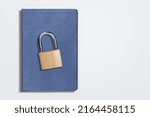 Small photo of The book is locked under lock. Secret archive. Chain on the book of secrets is under lock and key.