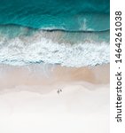 Small photo of Beautiful beach and water at sunrise with people standing in front of wave and on white sand on the Gold Coast. Queensland New South Wales Brisbane Byron Bay Sunshine Coast Noosa Bondi Manly